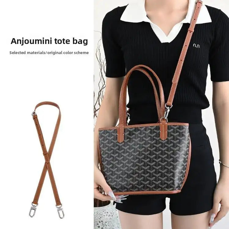 Brown leather replacement strap for Anjoumini tote bag, shown with patterned handbag and model