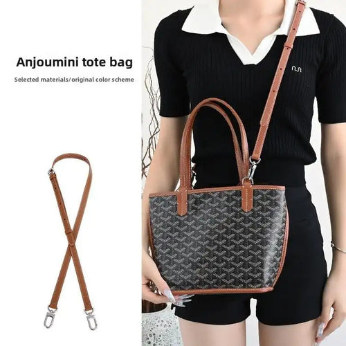 Brown leather replacement strap for Anjoumini tote bag, shown with patterned handbag and model