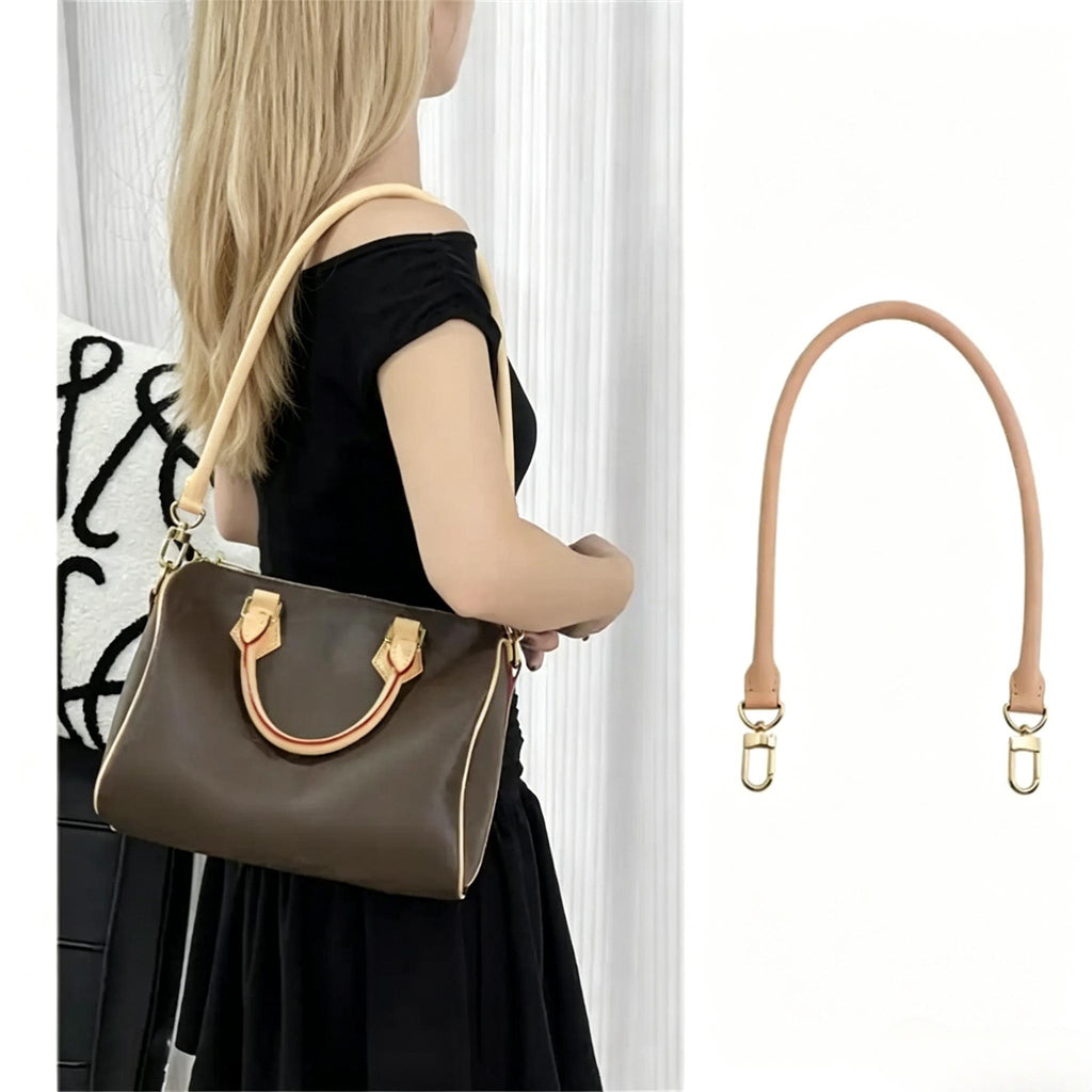 Beige leather bag strap replacement with gold hardware, shown on brown handbag and isolated