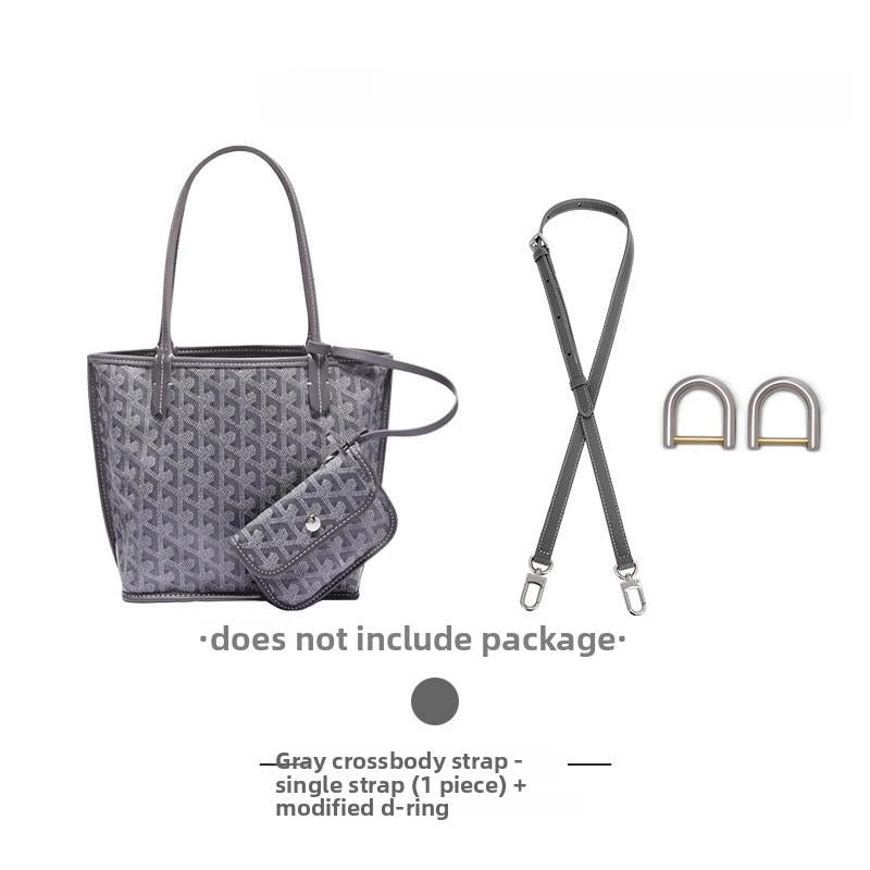 Gray crossbody strap with modified D-rings for bag customization, sold separately